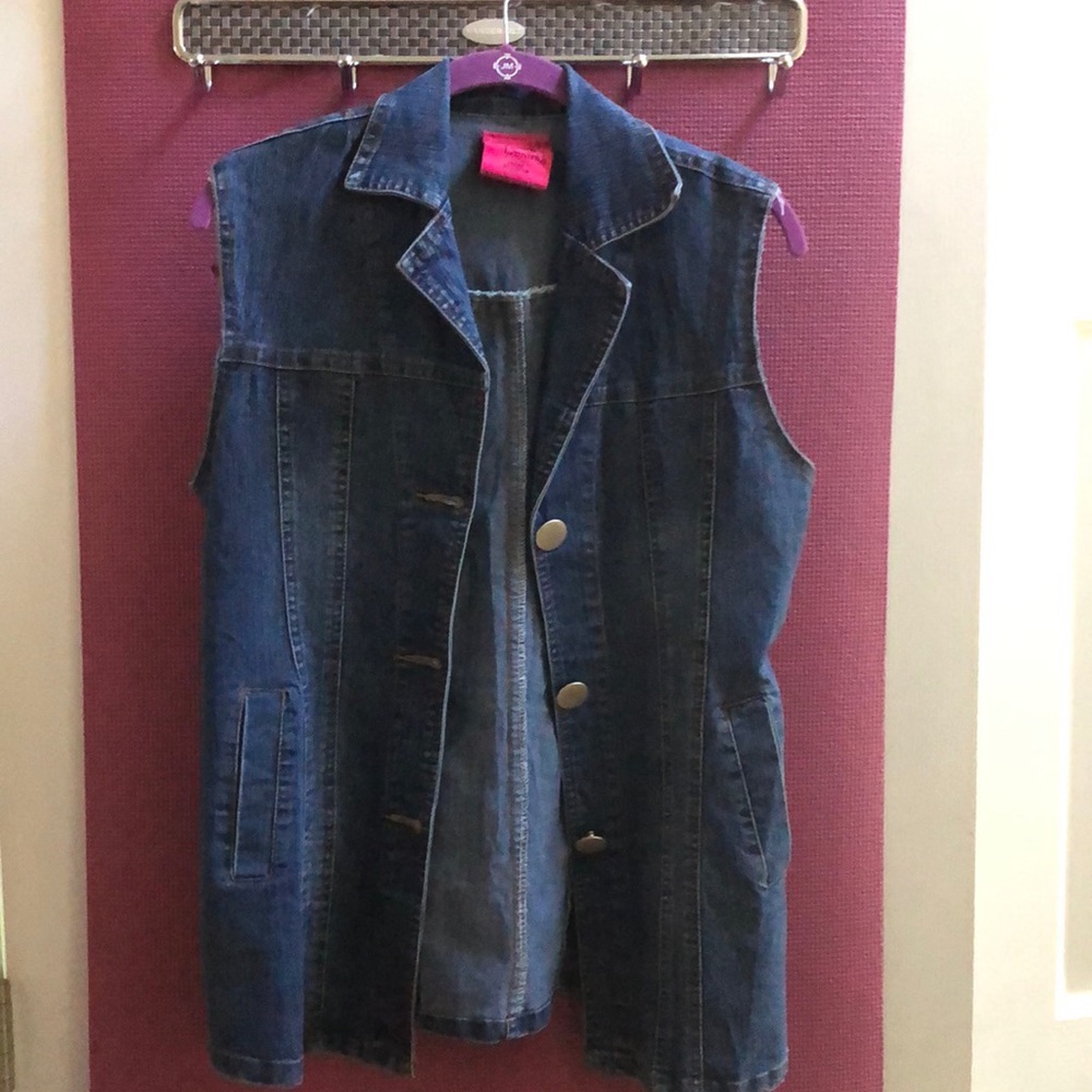 Denim jean-jacket vest with silver buttons.